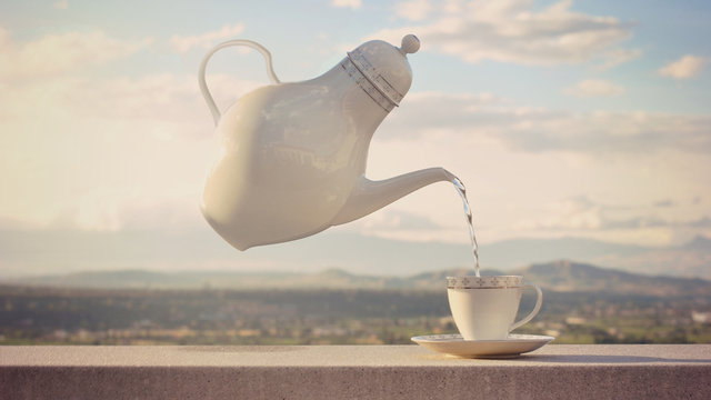 Conceptual floating teapot pouring tea into a cup