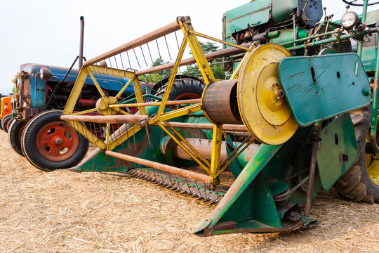 Agriculture, old grain thresher, agricultural tractor