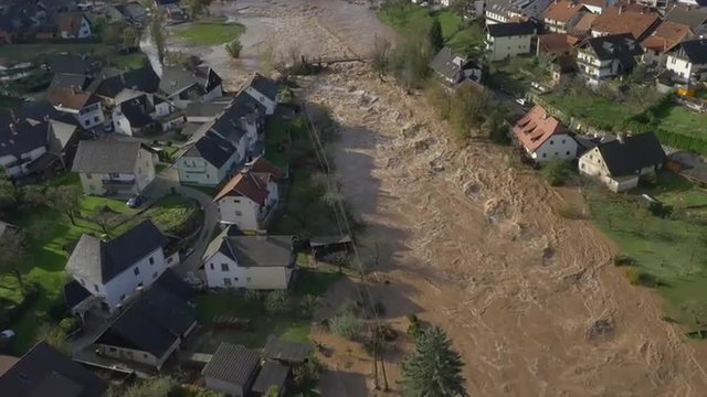 AERIAL: Big river flooding the suburbs after heavy rain