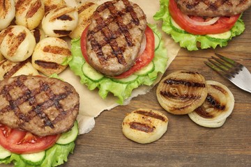 Lunch With Homemade BBQ Grilled Hamburgers On The Picnic Table