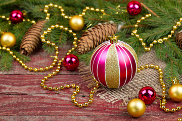 Obraz na płótnie Canvas Christmas ornaments and fir cones