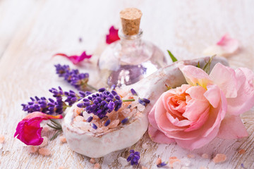 Spa still life with lavender, bathing salt, massage oil and rose flower