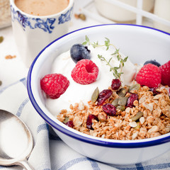 Healthy breakfast. Granola with pumpkin seeds, honey, yogurt ,fresh berries.