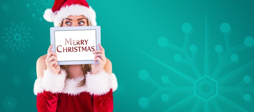 Composite image of pretty santa girl holding tablet