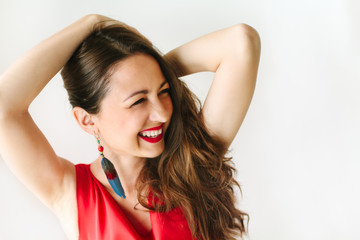 portrait of a young beautiful women in red dress with brunette h