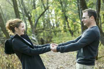 Happy middle aged couple outdoors on beautiful autumn day