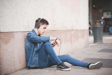young handsome alternative man listening music