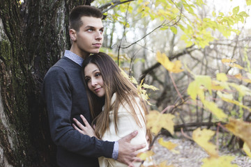 Teen couple at autumn park