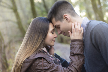 Teen couple at autumn park