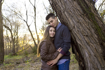 Teen couple at autumn park