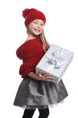 Pretty little girl holding a present isolated on white