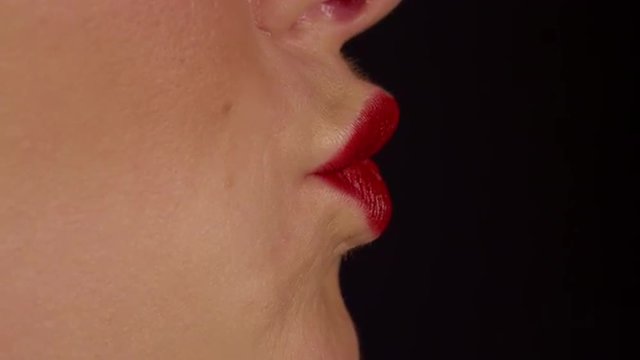 SLOW MOTION CLOSE UP: Woman kiss and smile