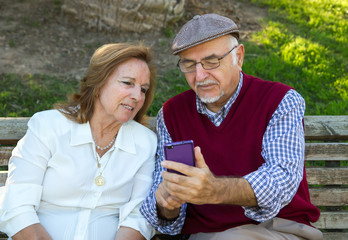 Senior man and senior woman doing a self-portrait