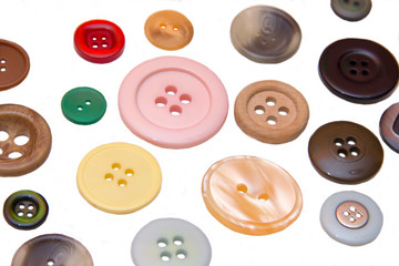 Colored buttons on a white background seen up close