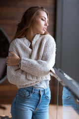 Woman looking at window