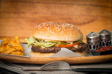 Cheeseburger served  with French Fries and Beer
