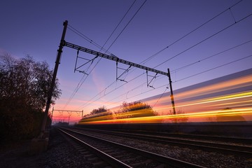 Fototapeta na wymiar Train at the sunrise