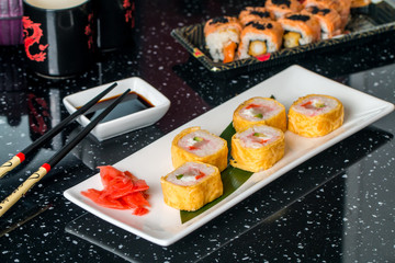 Sushi roll with scallop and Tomago