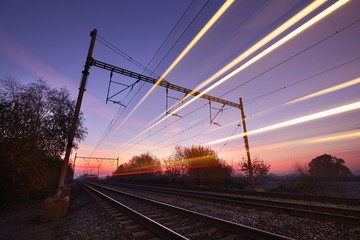 Fototapeta premium Pociąg na wschód słońca