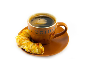 cup of cappuccino and cookies