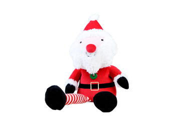 Toy santa sitting on white background. Soft toy Santa Claus