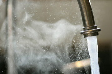 Hot Steaming Water Running from Kitchen Faucet - Powered by Adobe