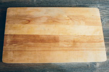 Cutting wooden board lying on the table