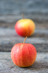 Apples on old wooden background.