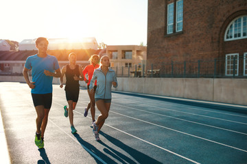 Professional runners running on a race track