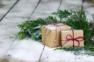 Brown paper packages on winter background