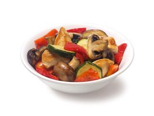 
Sauteed zucchini with chicken mushrooms   pepper on a white background
