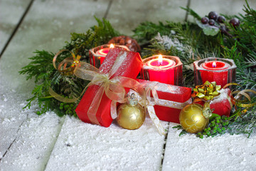 Fototapeta na wymiar Christmas decorations on snowy background