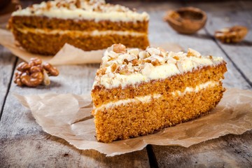 Piece of homemade carrot cake with walnuts