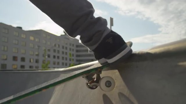 SLOW MOTION CLOSE UP: Riding a skate ramp