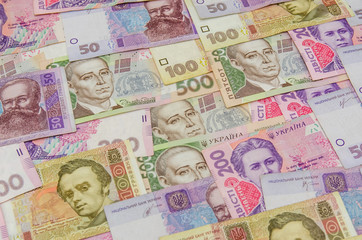 Fototapeta na wymiar different ukrainian banknotes background close-up