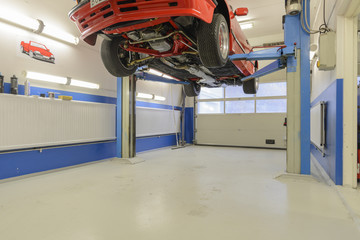 garage with lifted car
