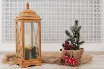 Wooden lantern and christmas decoration on white background