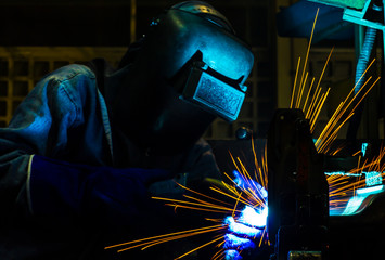 Welder movement Industrial automotive part in factory