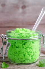 Green scrub in a glass jar