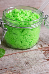 Green scrub in a glass jar