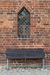 Fototapeta na wymiar Bench and Church Window