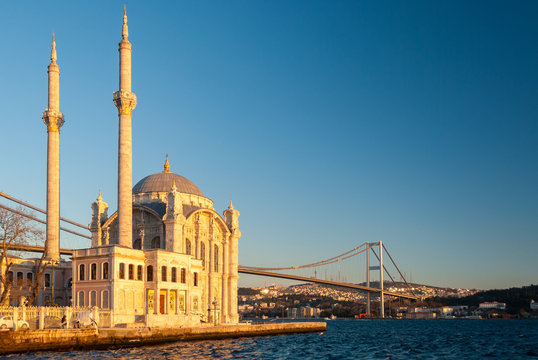 The Ortakoy Mosque and the bridge across the Bosphorus in Istanbul during the afternoon