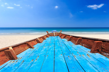 Front of traditional Thai boat and view of tropical sea