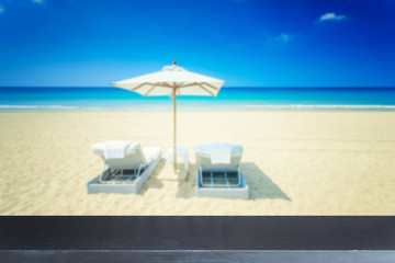 Empty top of natural stone table and view of tropical beach
