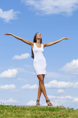 Beautiful young woman in white sexy dress