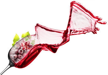 Obraz na płótnie Canvas red wine splash with pink grape in glass