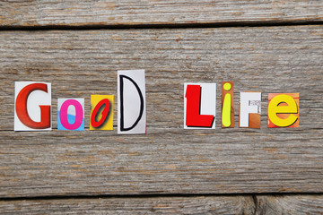 The word Good Life in cut out magazine letters