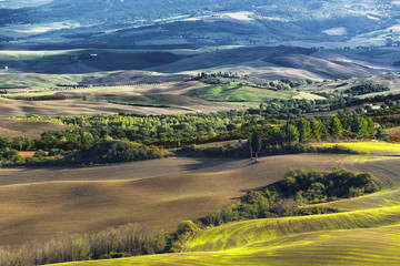 Fototapeta na wymiar Plowed fields in the picturesque landscape of Italy.
