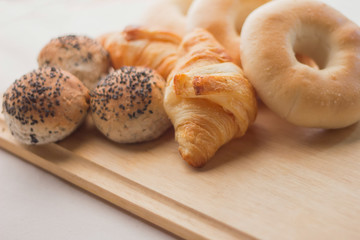 fresh bread  on the wooden board and white background