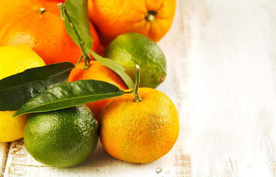 Fresh citrus fruits with leaves